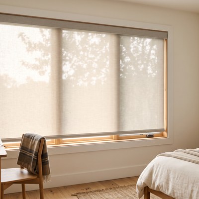 Roller Shade in a 3% opacity fabric installed in a bedroom